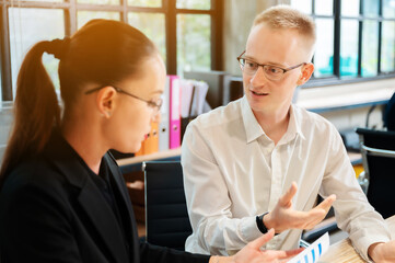 Obraz premium Business people discussing idea together about planning marketing strategy. Businessman and businesswoman meeting at office
