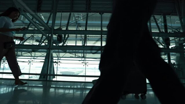 Silhouette of passenger walking in the airport