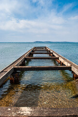 Broken pier on the seashore. Travel.