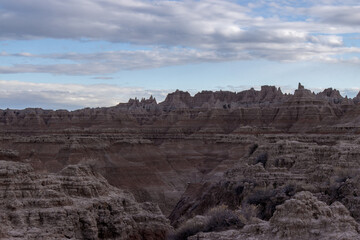 Clouds form over a canyon at Badlands National Park in South Dakota 