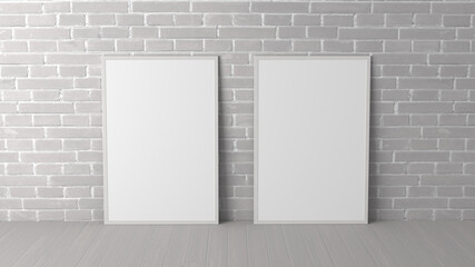 Mock up of two vertical frames on the floor in white interior.