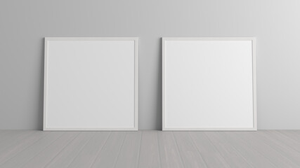 Mock up of two square frames on the floor in white interior.