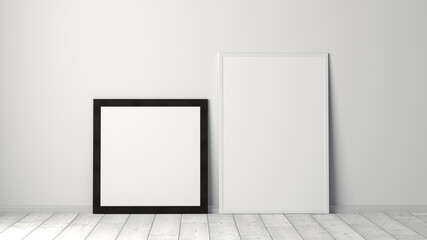 Mock up of square and vertical black and white frames on the floor with white wall.