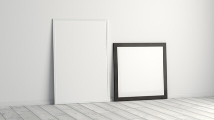 Mock up of square and vertical black and white frames on the floor with white wall.