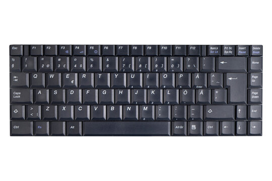 Closeup of a modern computer keyboard isolated on white background. Close up view of a business workplace with wireless computer keyboard. Top view.