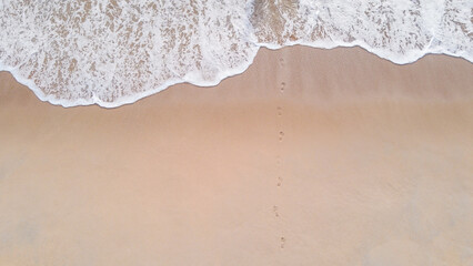 Top Angle shots mysterious disappearance on the beach summer have the only footprint left on the sand no body.
