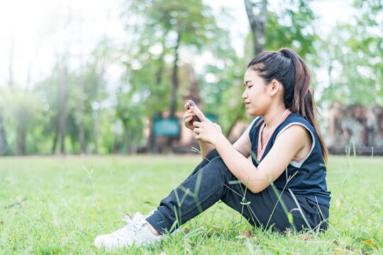 Gorgeous, modern and young woman, spending her leisure time on a spring day in the park.