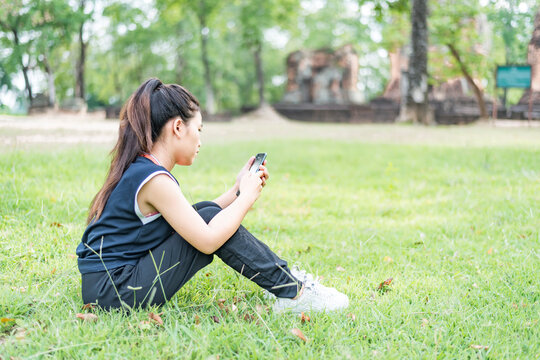 Gorgeous, modern and young woman, spending her leisure time on a spring day in the park.