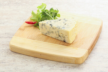 Blue cheese piece over board