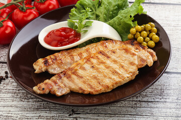 Grilled pork steak with ketchup