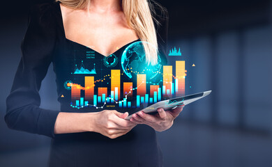 Businesswoman with tablet, earth globe and stock market dynamics