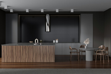 Grey kitchen interior with countertop and eating area, kitchenware