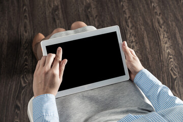 business woman with tablet on her lap