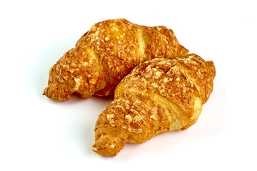 Freshly baked croissants, isolated on white background.