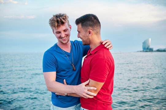 two gay men at Barcelona beach on a summer day