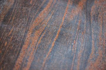 brown granite pattern with curly grey and gold veins. Abstract texture and background
