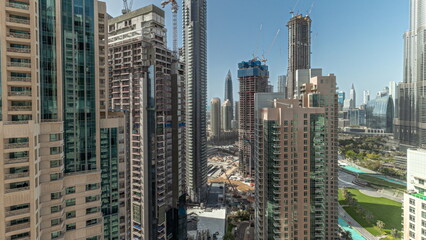 Obraz premium Panorama showing Dubai Downtown cityscape with tallest skyscrapers around aerial timelapse.