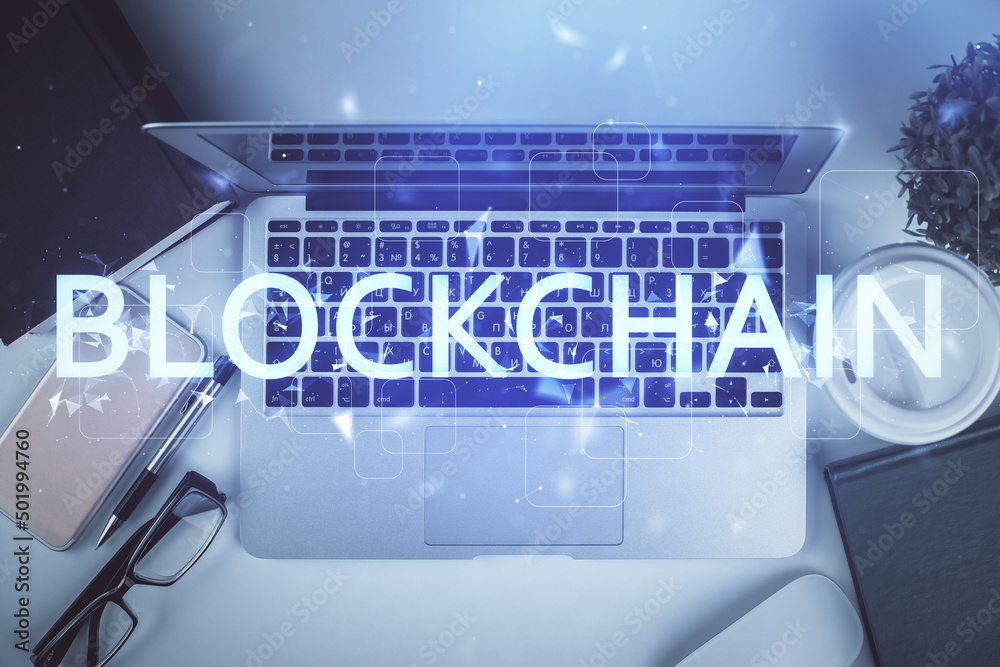 Poster blockchain theme hologram drawings over computer on the desktop background. top view. double exposur