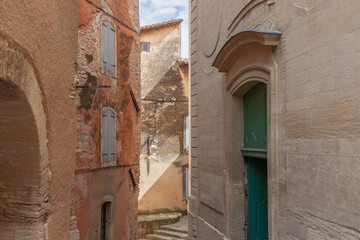 Fototapeta na wymiar Medieval provencal village Gordes narrow streets, limestone old buildings with portals. Vaucluse, Provence, Alpes, Cote d'Azur, France