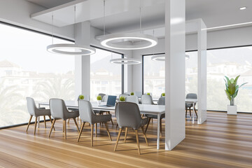 Corner view on bright office interior with panoramic windows