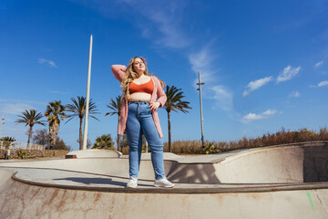 Beautiful plus size young woman outdoors, concepts about body acceptance, body positive and self esteem