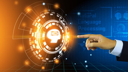 A businessman hand is reach out pointing to activate a brain of natural language processing or NLP system on a blue technology background.