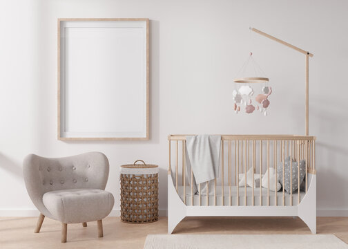 Empty vertical picture frame on white wall in modern child room. Mock up interior in scandinavian style. Free, copy space for your picture. Baby bed, armchair. Cozy room for kids. 3D rendering.