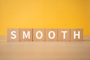 順調・スムーズのイメージ｜「SMOOTH」と書かれた積み木