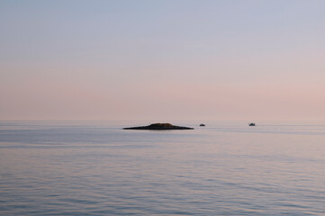 Calm seascape. Sunset on the sea, Porec, Istria, Croatia. Adriatic sea, evening seascape