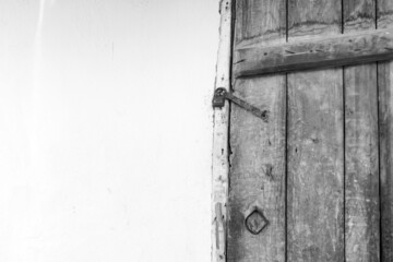 wooden door and there is a lock on it, the old classic house door with the lock