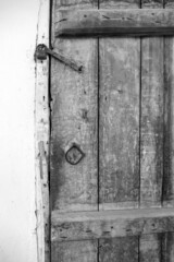 wooden door and there is a lock on it, the old classic house door and its lock are locked on it,