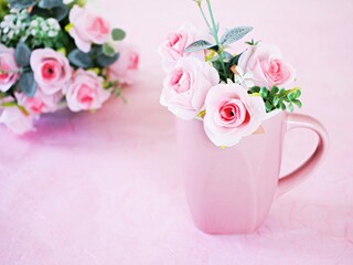 White cup of tea with pink rose on pink background ,Valentine's day romantic ,Mother's day ,pretty background or wallpaper ,soft selective focus ,wedding card design ,coffee cup ,lovely love card 