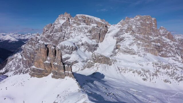 South Tyrol Mountains on Sunny Day in Winter. Aerial View. Sexten Dolomites, South Tyrol. Italy. Drone Flies Forward, Tilt Up. Reveal Shot