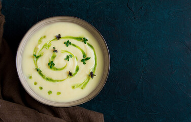 Mashed potatoes, with green butter, micro greenery, homemade, on a dark background, no people, top view,