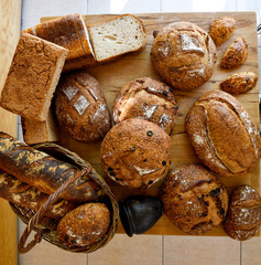 Table scene of assorted take out or delivery foods. Pizza, hamburgers, Doner, fried chicken and sides. Top down view on a table.