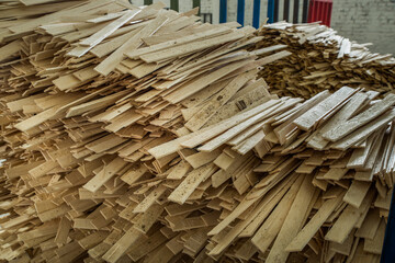 Woodworking industry. Natural veneer in bundles for further use in furniture manufacturing.