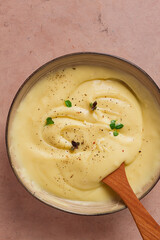 Mashed potatoes, with micro greenery and spices, homemade, on a beige table, no people, top view,