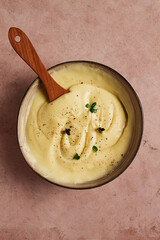 Mashed potatoes, with micro greenery and spices, homemade, on a beige table, no people, top view,