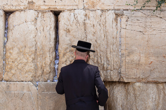 A Hasidic man praying at the Western Wall, Jerusalem, Israel

