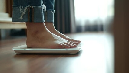 B roll - Woman Feet Standing Weighing Scales, Female Checking BMI Weight Loss. Barefoot Measuring Body Fat Overweight