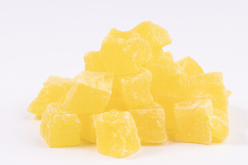 a bunch of yellow candied fruits close-up. sweet dessert