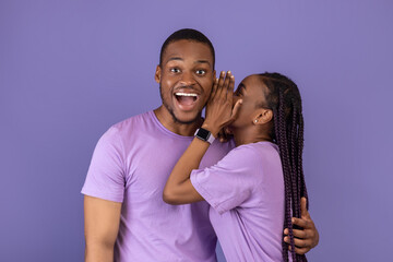 Black Woman Sharing News With Shocked Boyfriend Whispering To Ear