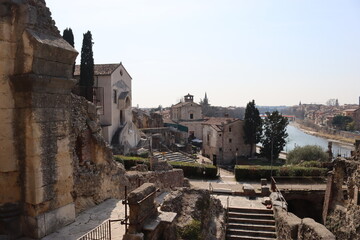 Verona, Italy-March 19, 2022: Beautifull old buildings of Verona. typical architecture of the medieval period. Aerial view to the city with blue sky in the background, beautiful view to  adige river.