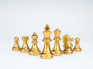 Set of luxury golden chess pieces isolated on white background. The photo of gold chess, king, rook, bishop, queen, knight, and pawn. © tete_escape