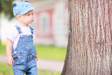 baby child on a summer walk in the park