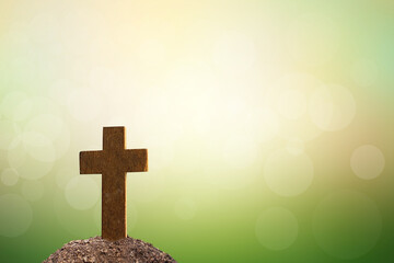 cross on tomb nature blur background