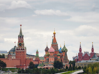 Naklejka premium Beautiful view of Red Square with Moscow Kremlin and St. Basil's Cathedral in rainy summer. This is main tourist destination in Moscow. Beautiful panorama of heart of city.