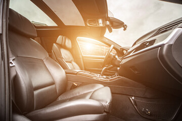 Car inside. Interior of prestige modern car. Comfortable leather seats. Black cockpit with on isolated white background.