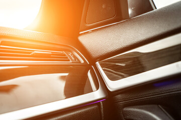 Car interior. Front handle door panel. Car open door window buttons.