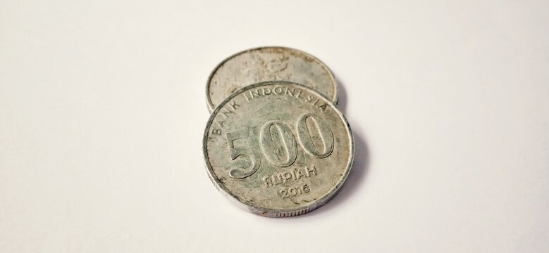 wo side of old 500 rupiah coin from Bank Indonesia with a grey background. Made of year is 2016. Indonesian rupiah, 500 Rupiah, Indonesian currency, Indonesian money background.